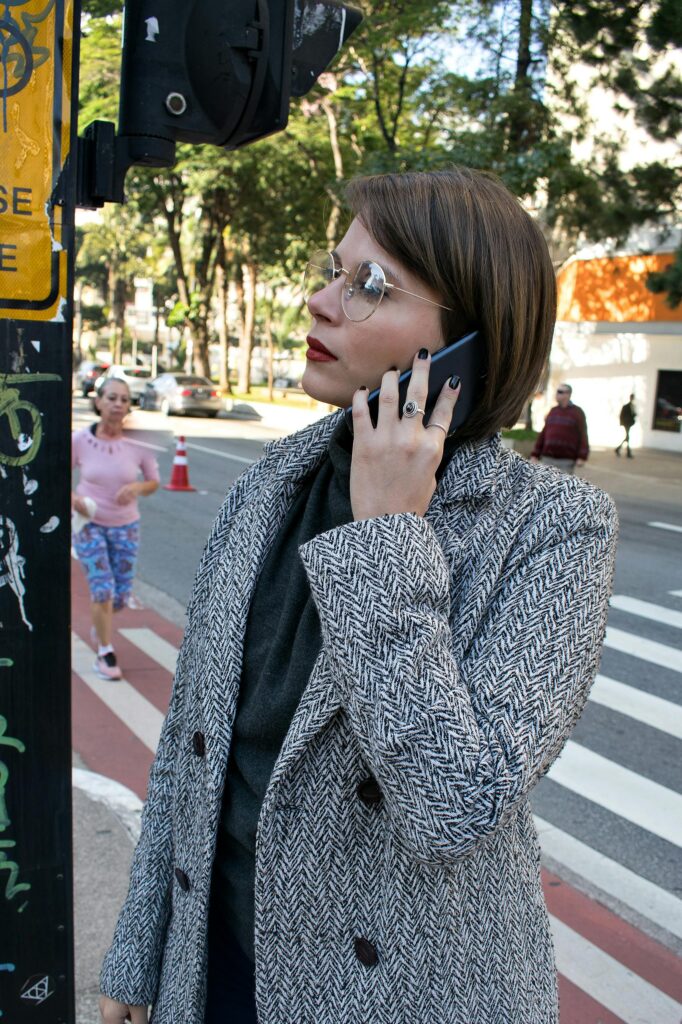 Photo of a Woman Calling Someone With Her Mobile Phone